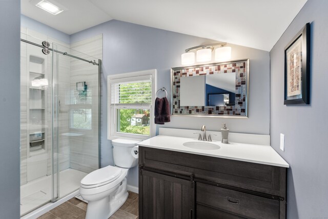 72 Lake View Dr, Woodstock, CT 06281 - bathroom with vaulted ceiling, toilet, vanity, and a shower stall