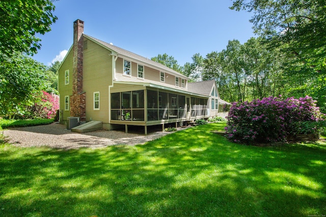 41 Blue Ridge Dr, Simsbury, CT 06089 - back of property featuring a sunroom, a chimney, and a yard