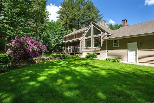 41 Blue Ridge Dr, Simsbury, CT 06089 - back of house featuring a sunroom, a chimney, and a yard