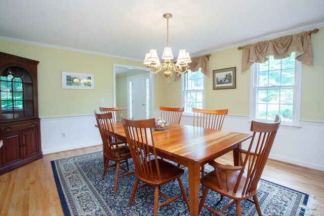 41 Blue Ridge Dr, Simsbury, CT 06089 - dining area with a chandelier, light wood-style flooring, and ornamental molding
