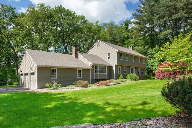 41 Blue Ridge Dr, Simsbury, CT 06089 - colonial house with a chimney, a front lawn, a garage, and roof with shingles