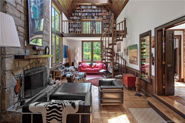 15 Tunxis Trl, Redding, CT 06896 - living room with stairway, high vaulted ceiling, a fireplace, and wood ceiling