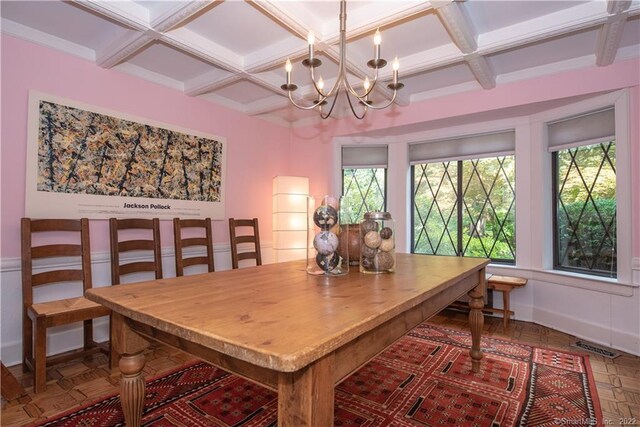 15 Tunxis Trl, Redding, CT 06896 - dining space featuring coffered ceiling, plenty of natural light, a chandelier, and beam ceiling