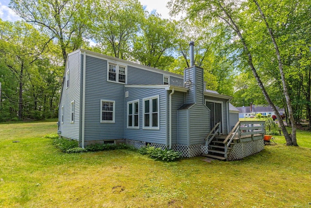 15 Woodcliff Dr, Simsbury, CT 06070 - back of house featuring a chimney, a deck, and a yard