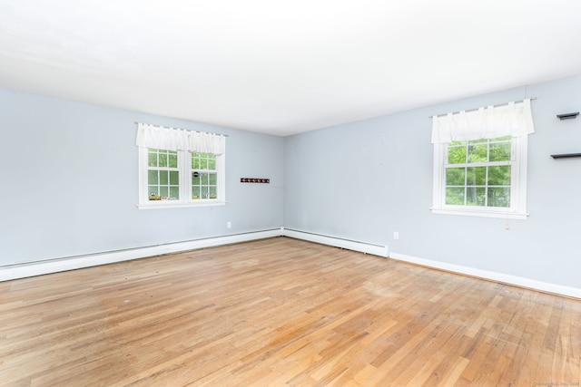 15 Woodcliff Dr, Simsbury, CT 06070 - unfurnished room featuring plenty of natural light, wood finished floors, and baseboards