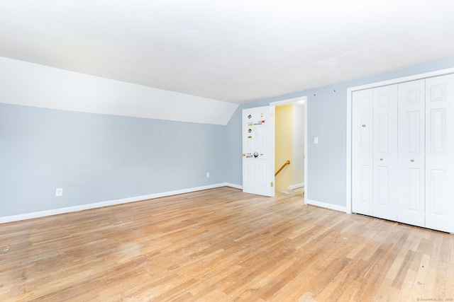 15 Woodcliff Dr, Simsbury, CT 06070 - bonus room featuring baseboards, light wood-type flooring, and lofted ceiling