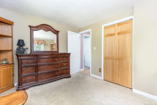 15 Woodcliff Dr, Simsbury, CT 06070 - bedroom featuring light colored carpet, baseboards, and a closet