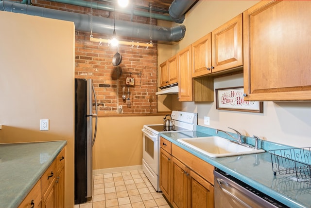 92 Main St Unit 214, Deep River, CT 06417 - kitchen with stainless steel appliances, under cabinet range hood, a sink, light tile patterned floors, and brick wall