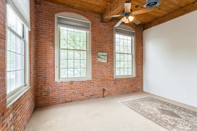 92 Main St Unit 214, Deep River, CT 06417 - spare room featuring wooden ceiling with exposed beams, healthy amount of natural light, brick wall, carpet floors, and ceiling fan