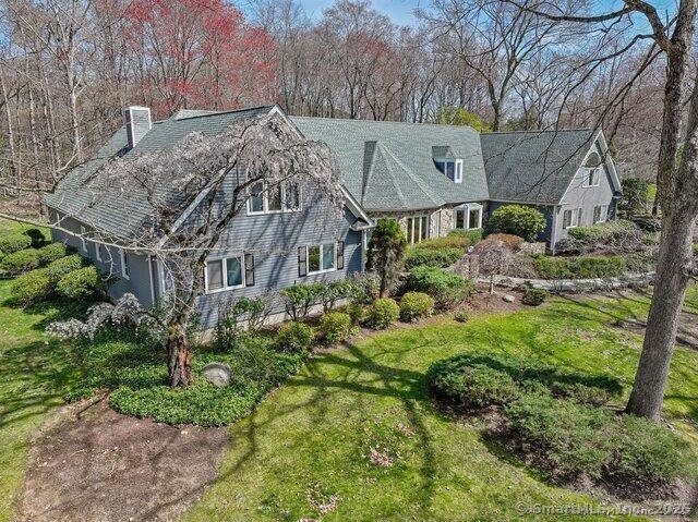 212 Fence Row Dr, Fairfield, CT 06824 - shingle-style home with a chimney and a front yard