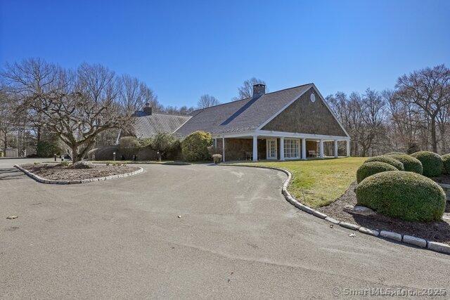 212 Fence Row Dr, Fairfield, CT 06824 - ranch-style home with a front yard and a chimney