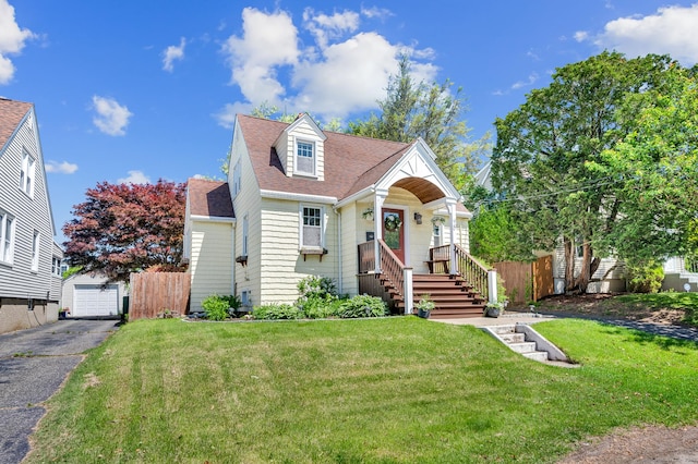 70 Mercer St, Stratford, CT 06614 - view of front of property featuring an outdoor structure, a shingled roof, and a garage