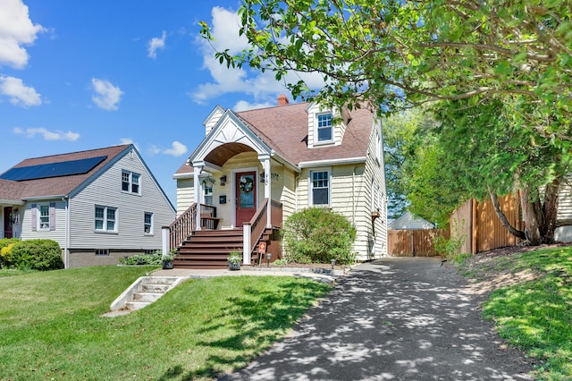70 Mercer St, Stratford, CT 06614 - view of front of house with driveway, a chimney, and a shingled roof