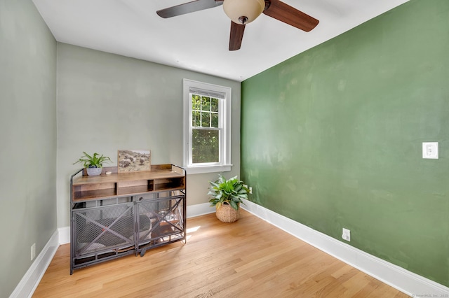 70 Mercer St, Stratford, CT 06614 - living area with wood finished floors, ceiling fan, and baseboards