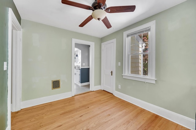 70 Mercer St, Stratford, CT 06614 - unfurnished room with baseboards, light wood-type flooring, and a ceiling fan