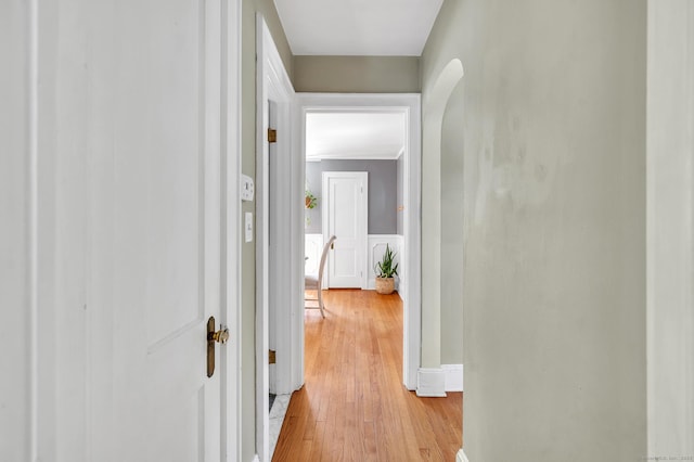 70 Mercer St, Stratford, CT 06614 - hall with light wood-type flooring, arched walkways, and ornamental molding