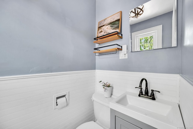 70 Mercer St, Stratford, CT 06614 - bathroom with wainscoting, toilet, and vanity
