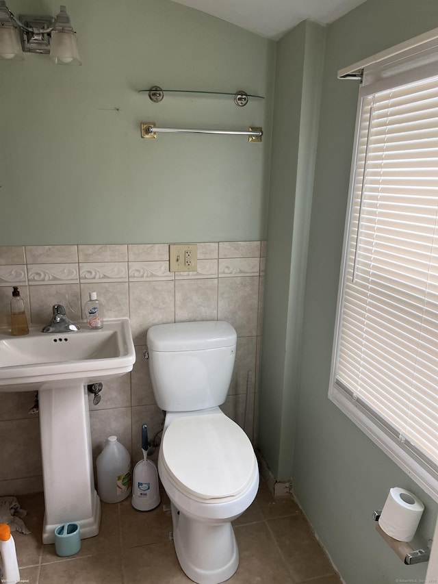 40 Bellevue Rd, New Haven, CT 06511 - half bath with tile patterned floors, toilet, tile walls, and wainscoting