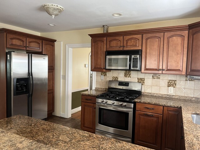 40 Bellevue Rd, New Haven, CT 06511 - kitchen with stainless steel appliances, baseboards, tasteful backsplash, dark stone countertops, and recessed lighting