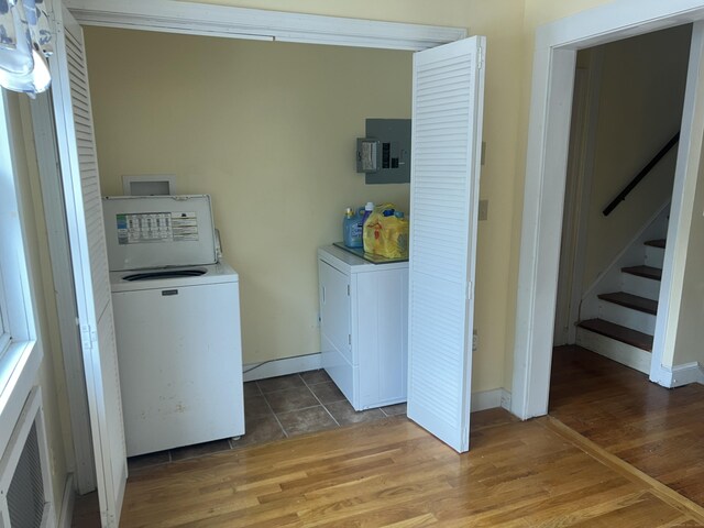 40 Bellevue Rd, New Haven, CT 06511 - laundry room with electric panel, independent washer and dryer, wood finished floors, and baseboards