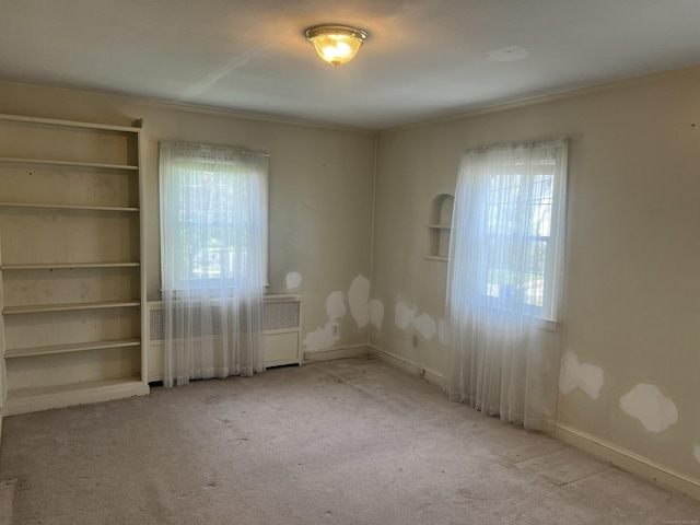 40 Bellevue Rd, New Haven, CT 06511 - carpeted empty room featuring radiator heating unit, baseboards, and ornamental molding
