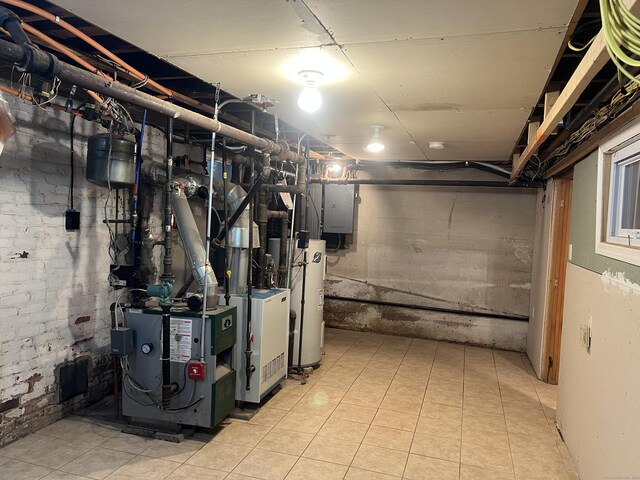 40 Bellevue Rd, New Haven, CT 06511 - unfinished below grade area featuring electric panel, water heater, and tile patterned flooring