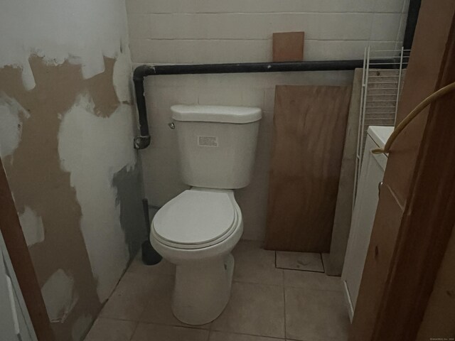 40 Bellevue Rd, New Haven, CT 06511 - bathroom with toilet, concrete block wall, tile patterned flooring, and vanity