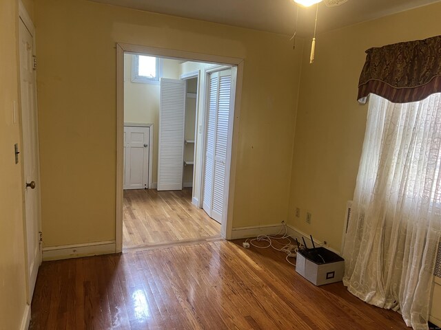 40 Bellevue Rd, New Haven, CT 06511 - unfurnished bedroom featuring wood finished floors and baseboards