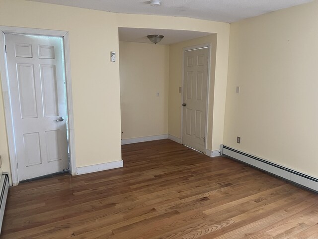 40 Bellevue Rd, New Haven, CT 06511 - unfurnished room featuring wood finished floors, baseboard heating, and baseboards