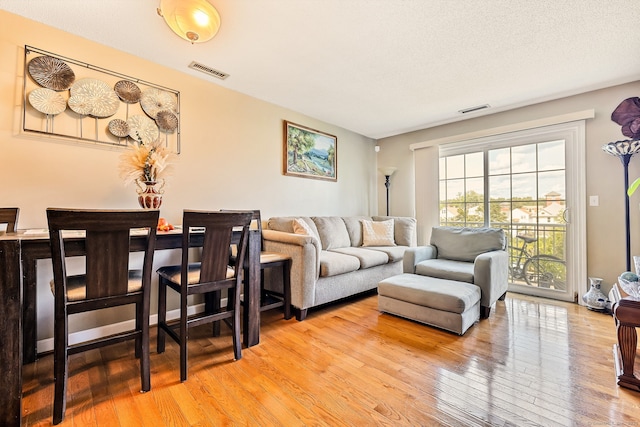 421 Tolland St Unit 312, East Hartford, CT 06108 - living area featuring light wood-style floors