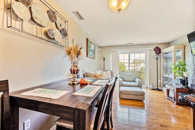 421 Tolland St Unit 312, East Hartford, CT 06108 - dining space with wood finished floors