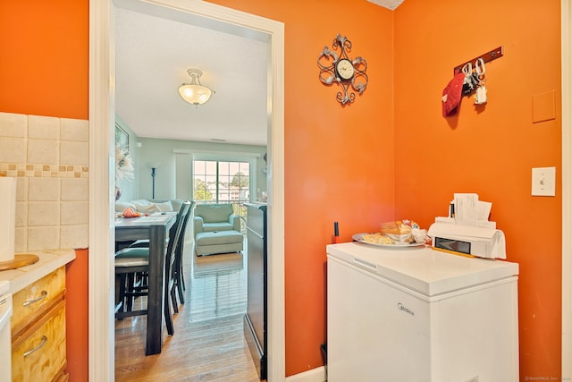 421 Tolland St Unit 312, East Hartford, CT 06108 - laundry room with light wood-style flooring