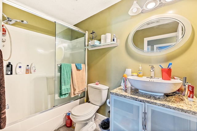 421 Tolland St Unit 312, East Hartford, CT 06108 - bathroom with vanity, shower / bath combination with glass door, and tile patterned floors