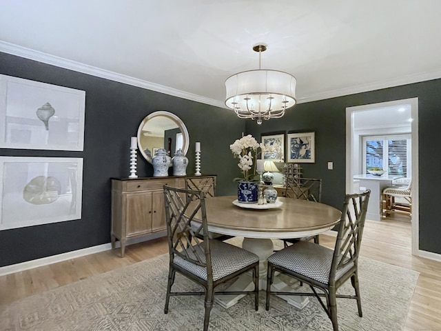 506 Jamestown Rd Unit 506, Stratford, CT 06614 - dining room with light wood-type flooring, a chandelier, crown molding, and baseboards