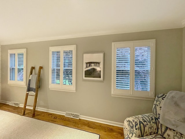 506 Jamestown Rd Unit 506, Stratford, CT 06614 - sitting room featuring baseboards, wood finished floors, and ornamental molding