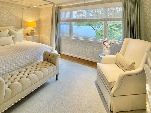 506 Jamestown Rd Unit 506, Stratford, CT 06614 - carpeted bedroom featuring wallpapered walls, baseboards, and wood finished floors