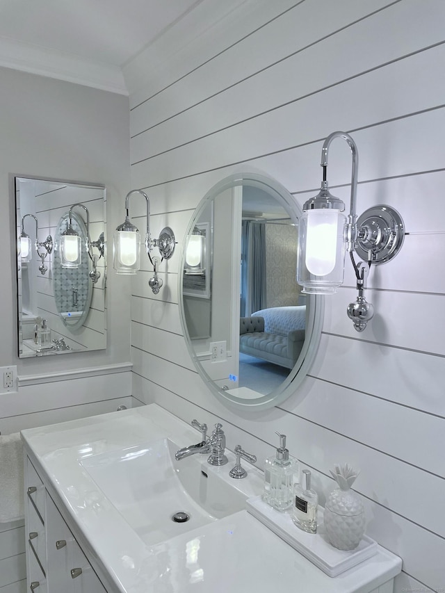506 Jamestown Rd Unit 506, Stratford, CT 06614 - bathroom featuring crown molding, wood walls, and vanity