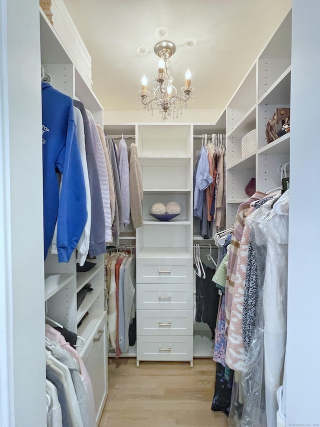 506 Jamestown Rd Unit 506, Stratford, CT 06614 - walk in closet with light wood-style floors and a chandelier