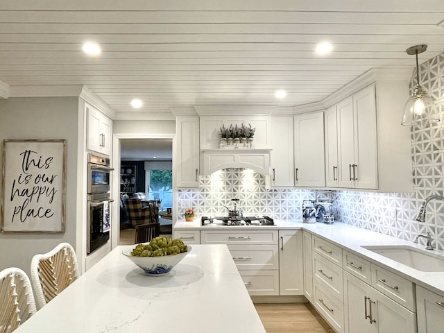506 Jamestown Rd Unit 506, Stratford, CT 06614 - kitchen featuring a sink, appliances with stainless steel finishes, white cabinets, recessed lighting, and decorative backsplash