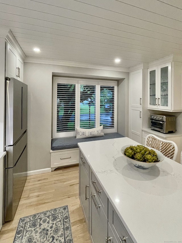 506 Jamestown Rd Unit 506, Stratford, CT 06614 - kitchen with freestanding refrigerator, light wood finished floors, recessed lighting, white cabinetry, and glass insert cabinets