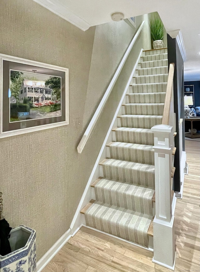 506 Jamestown Rd Unit 506, Stratford, CT 06614 - stairway featuring wood finished floors, crown molding, and baseboards