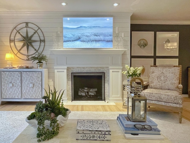 506 Jamestown Rd Unit 506, Stratford, CT 06614 - living area with wood finished floors, ornamental molding, a fireplace with raised hearth, and recessed lighting
