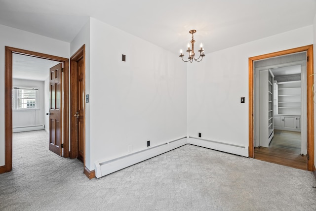 10 Wyndwood Rd, West Hartford, CT 06107 - unfurnished room with carpet floors, baseboard heating, and a chandelier