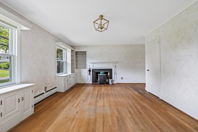 10 Wyndwood Rd, West Hartford, CT 06107 - unfurnished living room with a baseboard radiator, light wood finished floors, and a wood stove