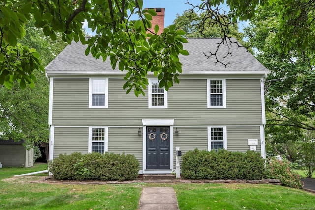 64 W St, Cromwell, CT 06416 - view of front of property featuring a front lawn, a chimney, and a shingled roof