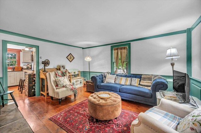 64 W St, Cromwell, CT 06416 - living room featuring wood finished floors and crown molding
