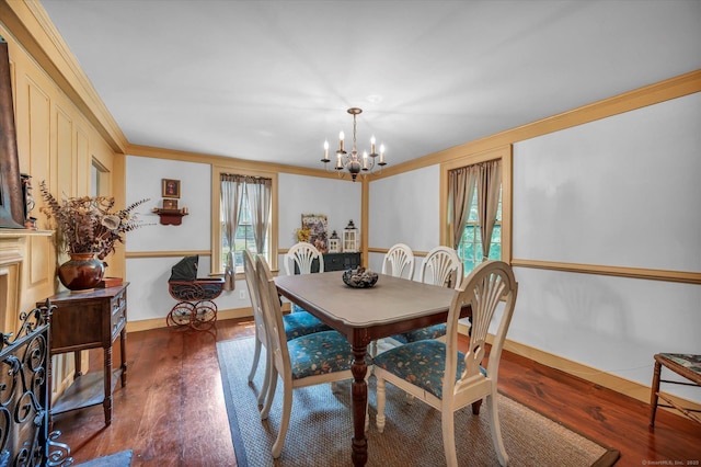 64 W St, Cromwell, CT 06416 - dining area with a chandelier, crown molding, wood finished floors, and baseboards