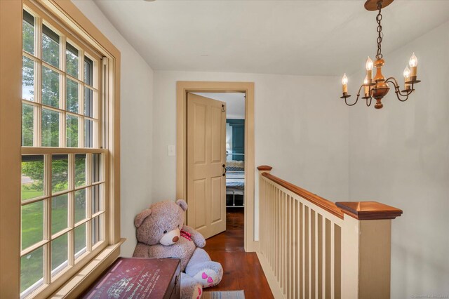 64 W St, Cromwell, CT 06416 - hall featuring wood finished floors, a chandelier, and an upstairs landing