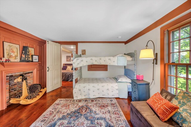 64 W St, Cromwell, CT 06416 - bedroom featuring wood finished floors, a fireplace, and crown molding