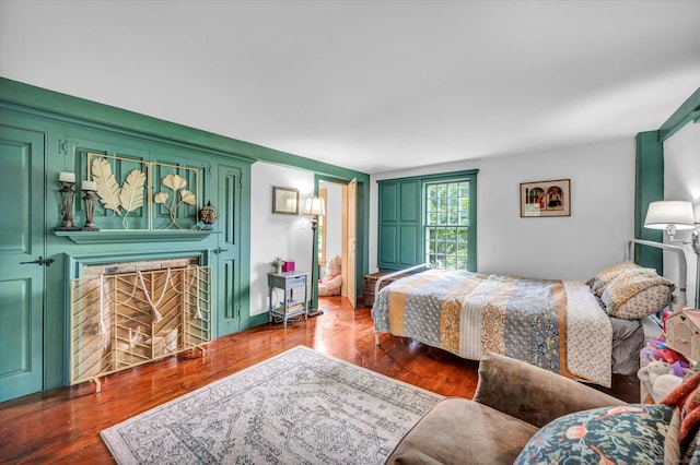 64 W St, Cromwell, CT 06416 - bedroom featuring a fireplace and wood finished floors